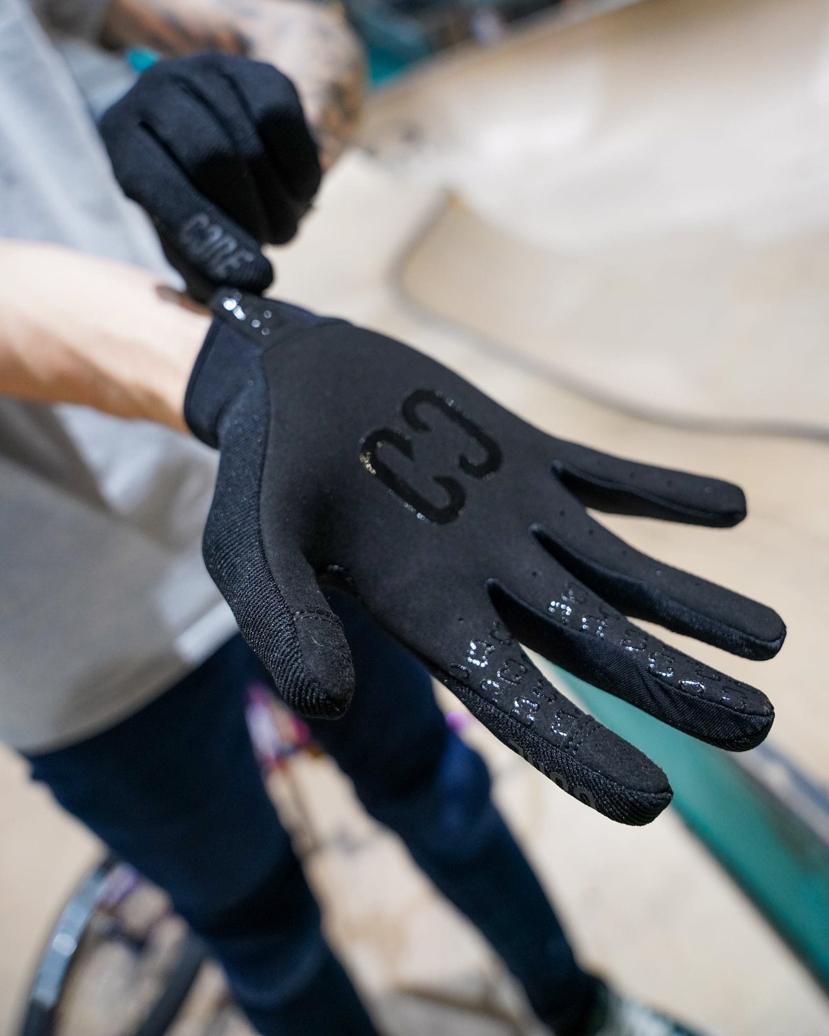 CORE Protection Aero BMX Gloves Stealth I Bike Gloves Putting Product On
