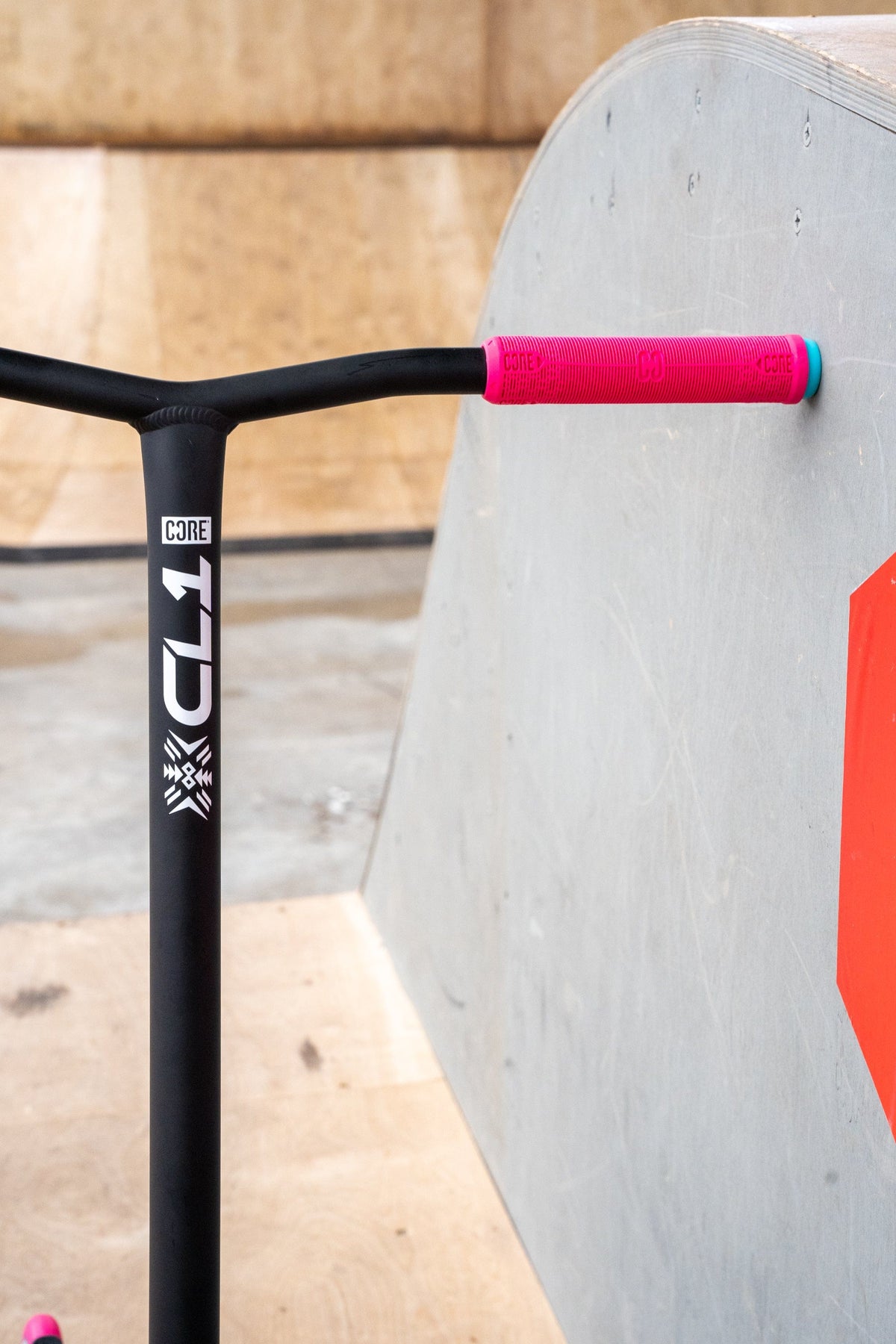 CORE CL1 complete stunt scooter in pink and teal - leaning