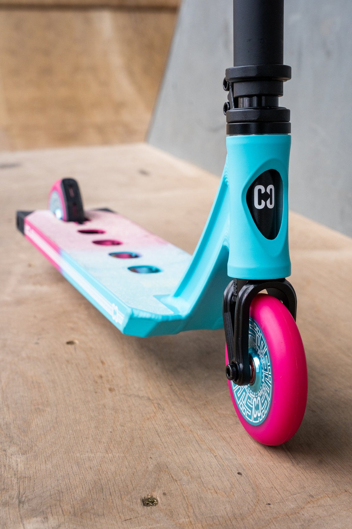 CORE CL1 complete stunt scooter in pink and teal - front end detail